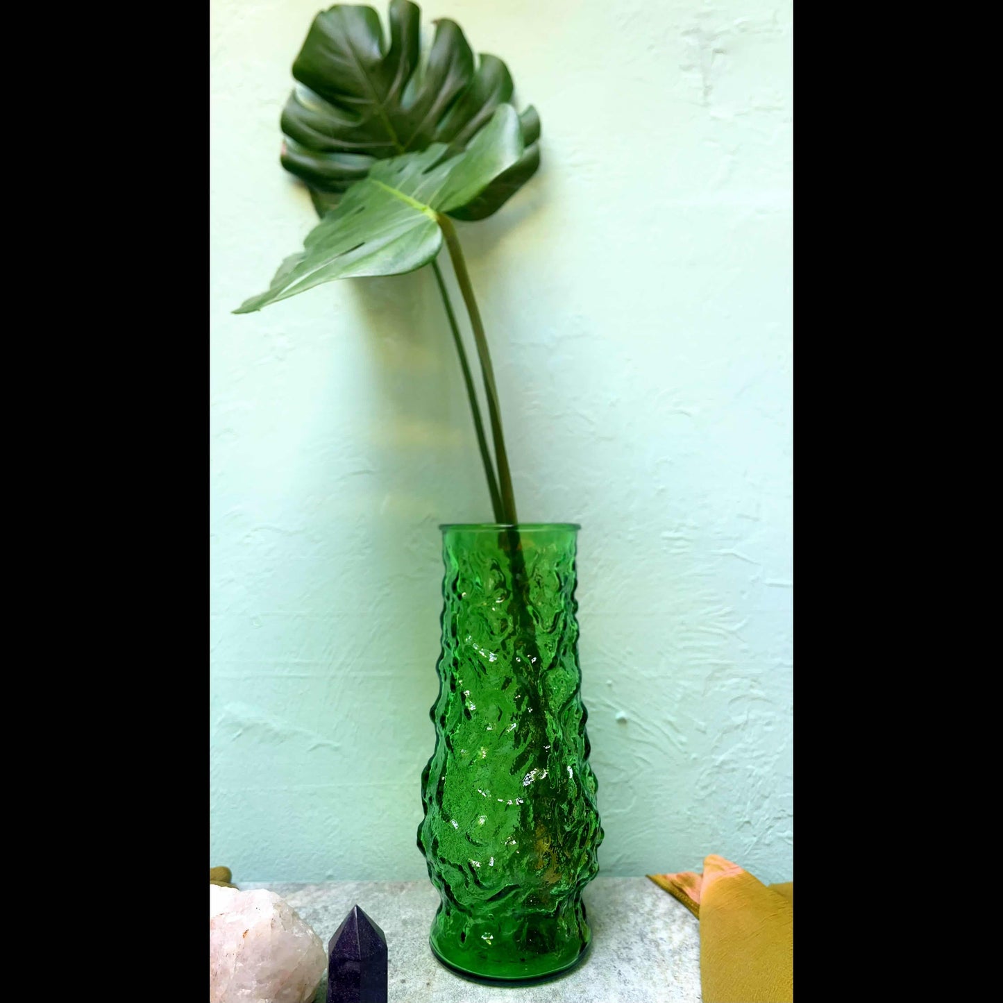 Prosperity's Embrace: Mid-Century Modern E.O. Brody Green Glass Vase & Monstera Deliciosa Charm